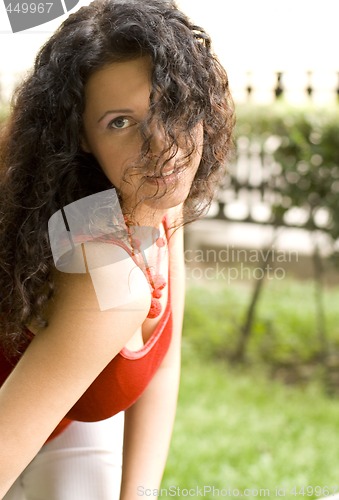 Image of beautiful brunet woman in red