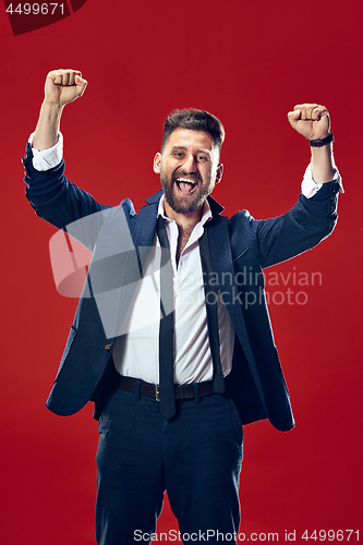 Image of Winning success man happy ecstatic celebrating being a winner. Dynamic energetic image of male model