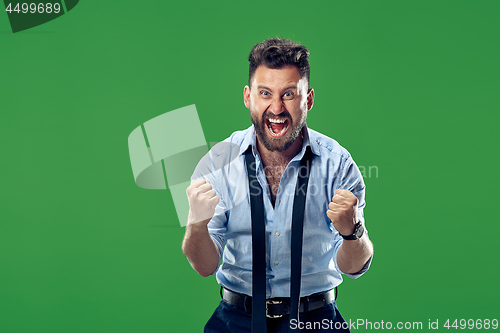 Image of Winning success man happy ecstatic celebrating being a winner. Dynamic energetic image of male model