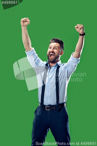 Image of Winning success man happy ecstatic celebrating being a winner. Dynamic energetic image of male model