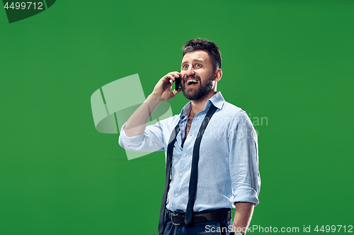 Image of Handsome businessman with mobile phone