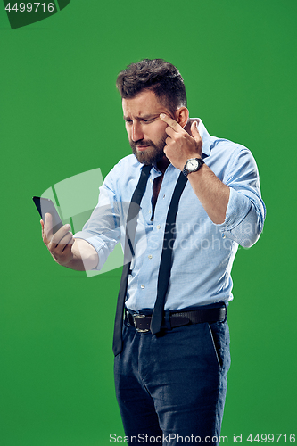 Image of Handsome businessman with mobile phone