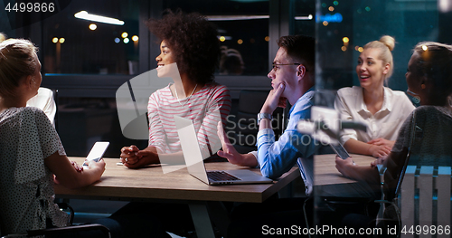 Image of Multiethnic startup business team in night office