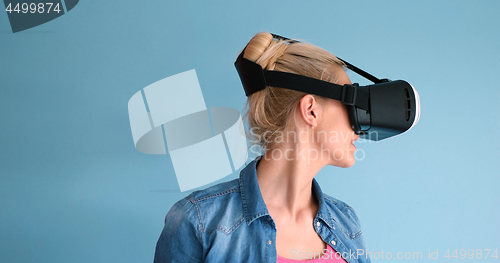 Image of woman using VR headset glasses of virtual reality