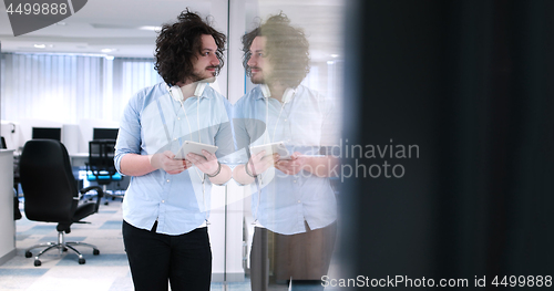 Image of businessman using tablet computer