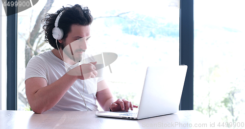 Image of man drinking coffee enjoying relaxing lifestyle