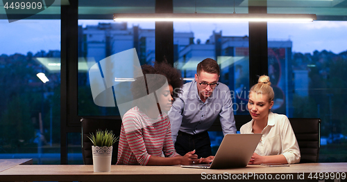 Image of Multiethnic startup business team in night office