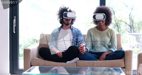 Image of Multiethnic Couple using virtual reality headset