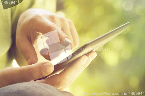 Image of Man holding tablet