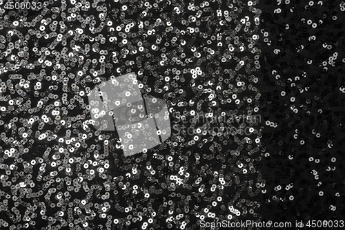 Image of Stylish black textile with shiny silver sequins