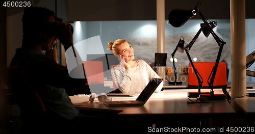 Image of young designers in the night office