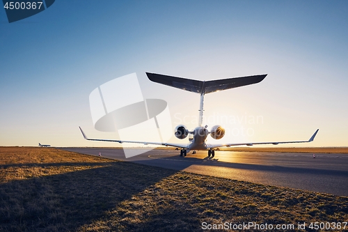 Image of Private jet at sunset