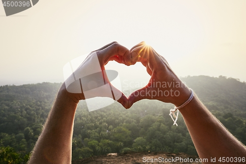 Image of Heart shape against sunset