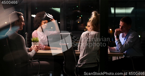 Image of Multiethnic Business team using virtual reality headset