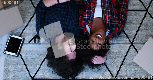 Image of Top view of attractive young multiethnic couple