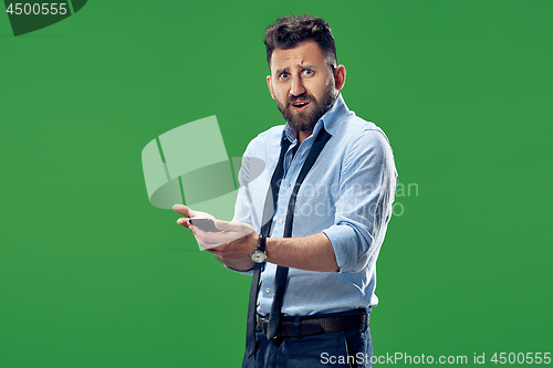 Image of Handsome businessman with mobile phone