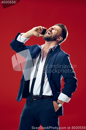 Image of Handsome businessman with mobile phone