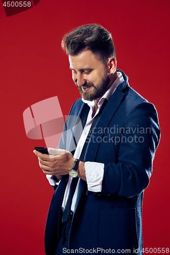 Image of Handsome businessman with mobile phone