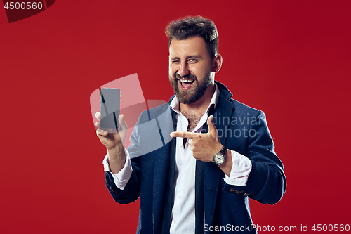 Image of Handsome businessman with mobile phone