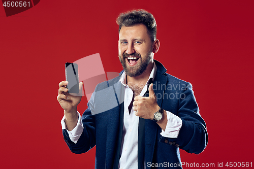 Image of Handsome businessman with mobile phone