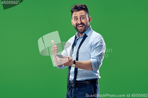 Image of Handsome businessman with mobile phone