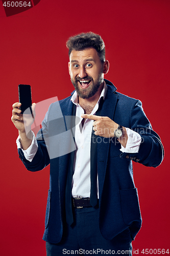 Image of Handsome businessman with mobile phone