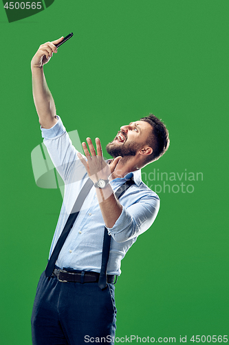 Image of Handsome businessman with mobile phone