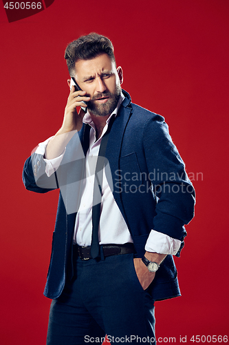 Image of Handsome businessman with mobile phone