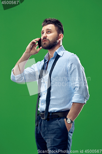 Image of Handsome businessman with mobile phone