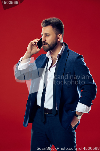 Image of Handsome businessman with mobile phone