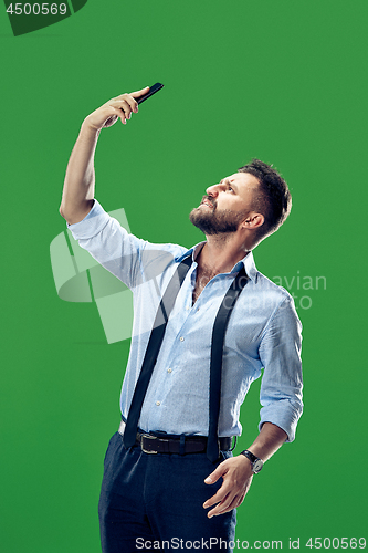 Image of Handsome businessman with mobile phone