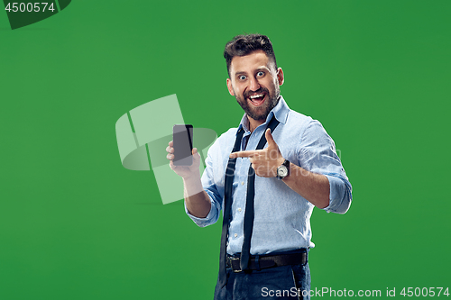 Image of Handsome businessman with mobile phone