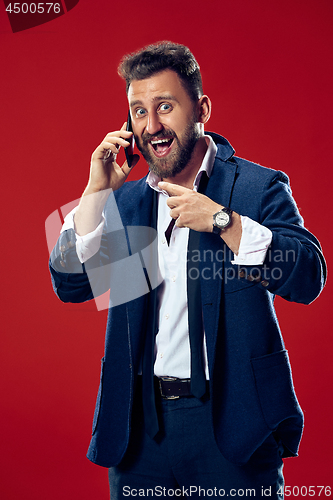 Image of Handsome businessman with mobile phone