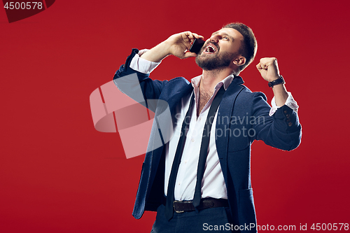 Image of Handsome businessman with mobile phone