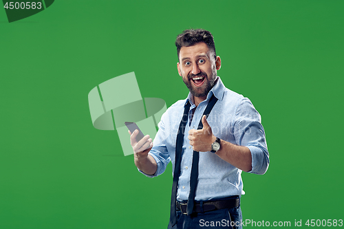 Image of Handsome businessman with mobile phone