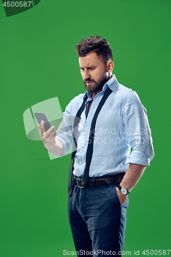 Image of Handsome businessman with mobile phone