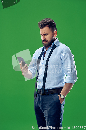 Image of Handsome businessman with mobile phone