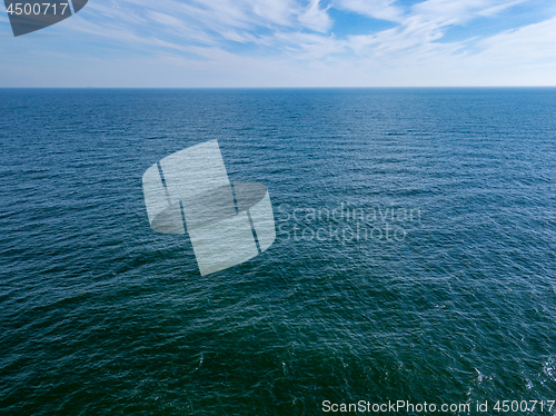 Image of Seascape with blue sea horizon and cloudy blue sky. Aerial bird\'s eye view from drone. Copy space. Natural background