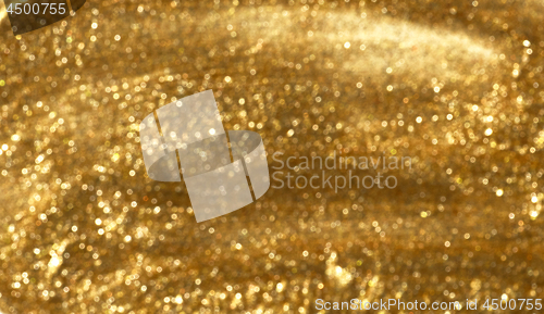 Image of blurred gold glitter background