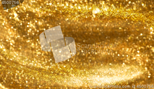 Image of blurred gold glitter background