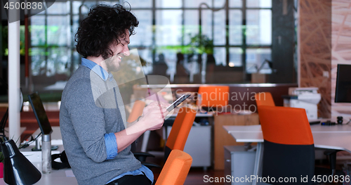 Image of businessman using tablet computer