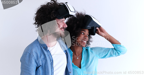 Image of multiethnic couple getting experience using VR headset glasses