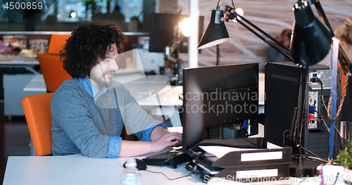 Image of businessman working using a computer in startup office