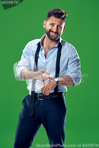 Image of Handsome businessman checking his wrist-watch Isolated on white background