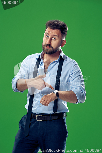 Image of Handsome businessman checking his wrist-watch Isolated on white background