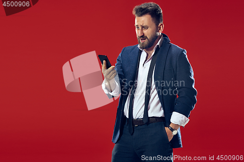 Image of Handsome businessman with mobile phone