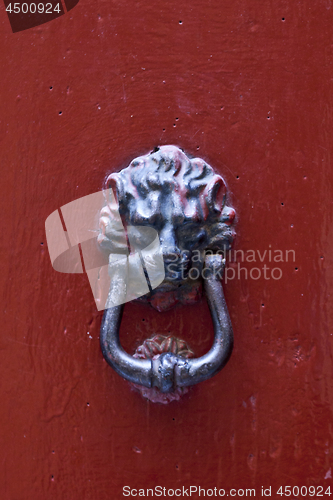 Image of Ancient italian lion shaped door knocker.