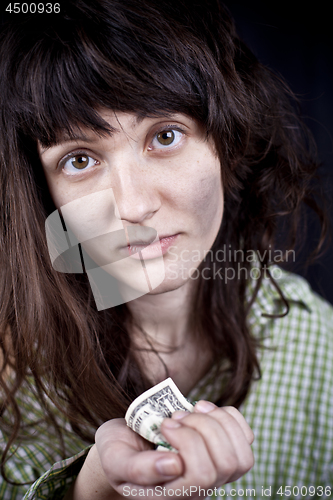 Image of Begging young woman with some money iin her hands.