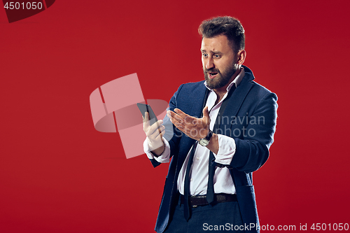 Image of Handsome businessman with mobile phone