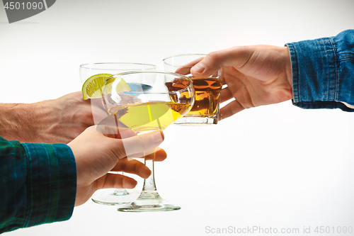 Image of The male and female hands with exotic cocktails